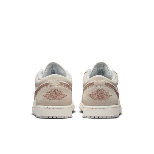 a pair of beige sneakers on a white background