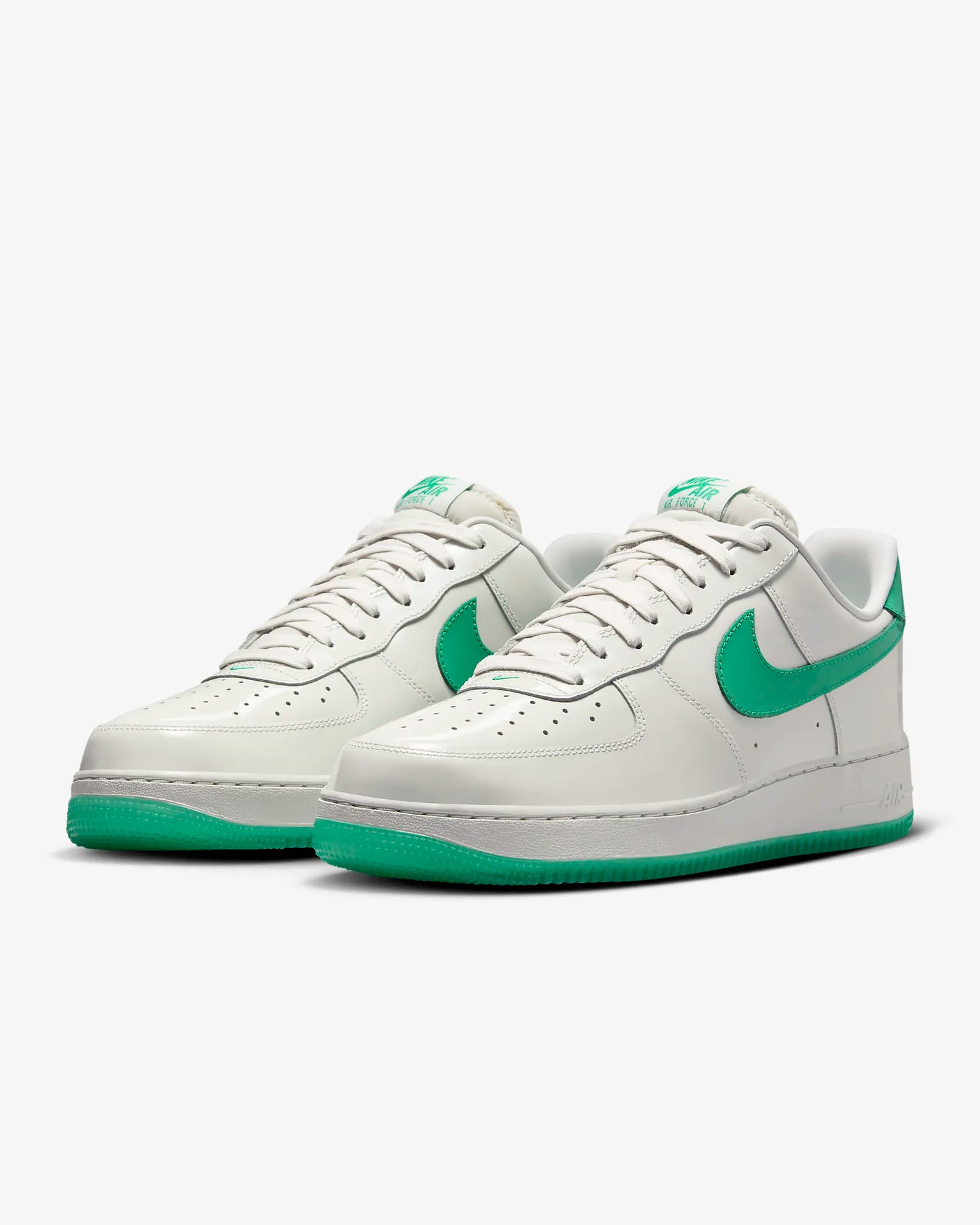 a white and green nike air force sneakers