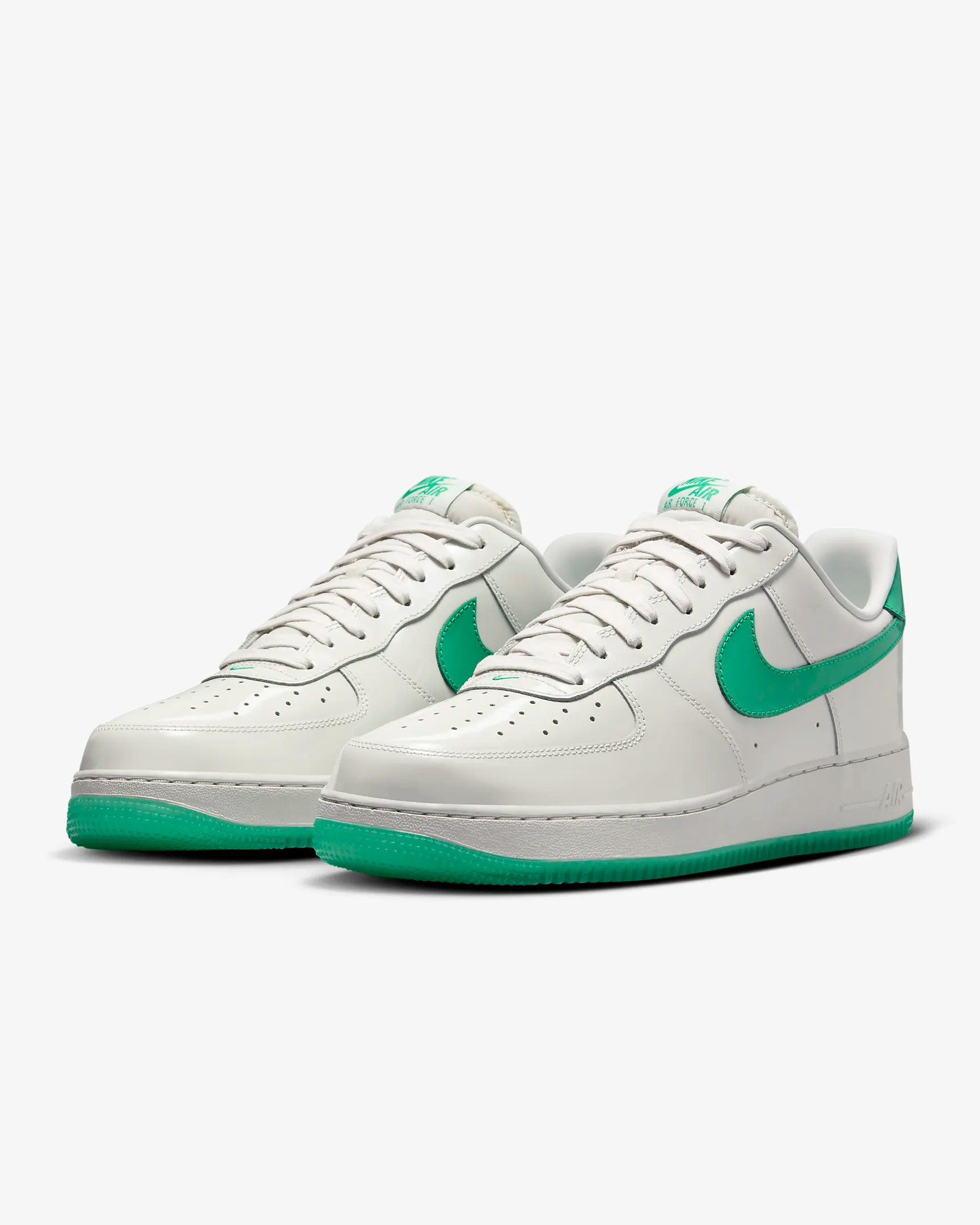 a white and green nike air force sneakers