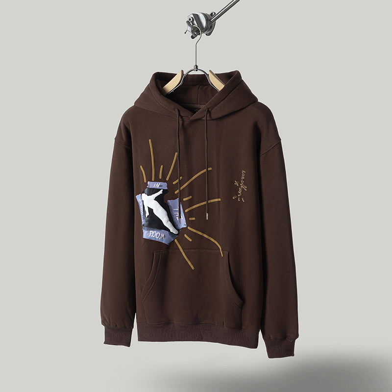 a brown sweatshirt with a picture of a cat on it