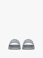 New
Slide flat sandals in monogram 72 rubber