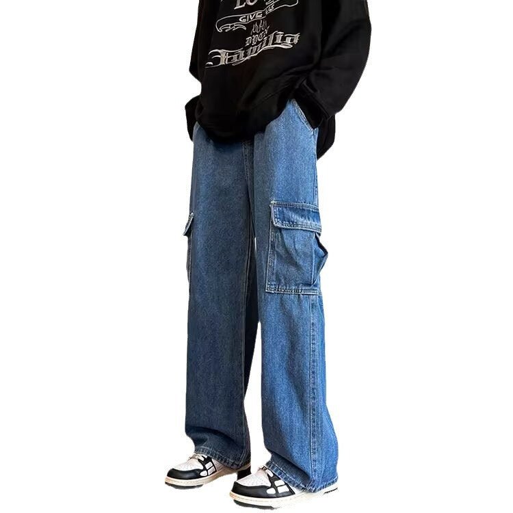 a man wearing a black sweatshirt and jeans