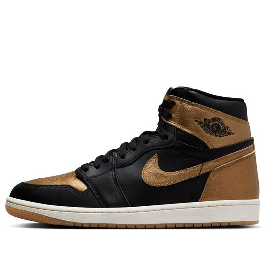 a pair of black and gold sneakers