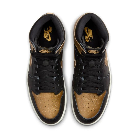 a pair of black and gold sneakers on a white background