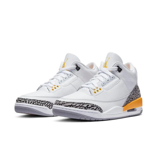 a pair of white and yellow sneakers on a white background